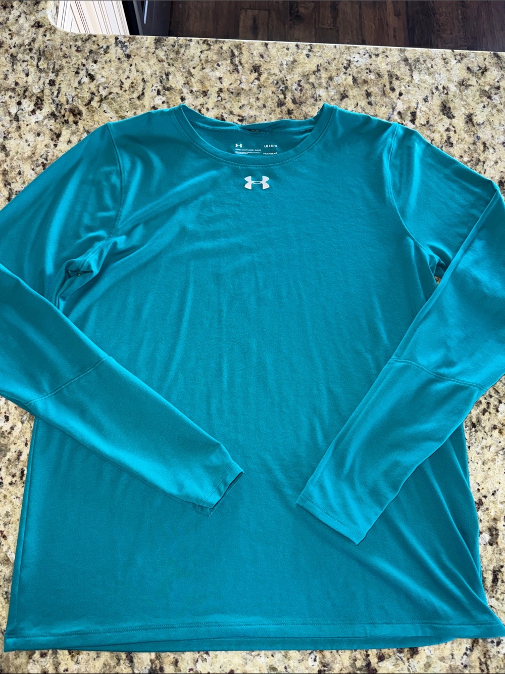 Under Armour women’s  Teal Long Sleeve Performance Shirt